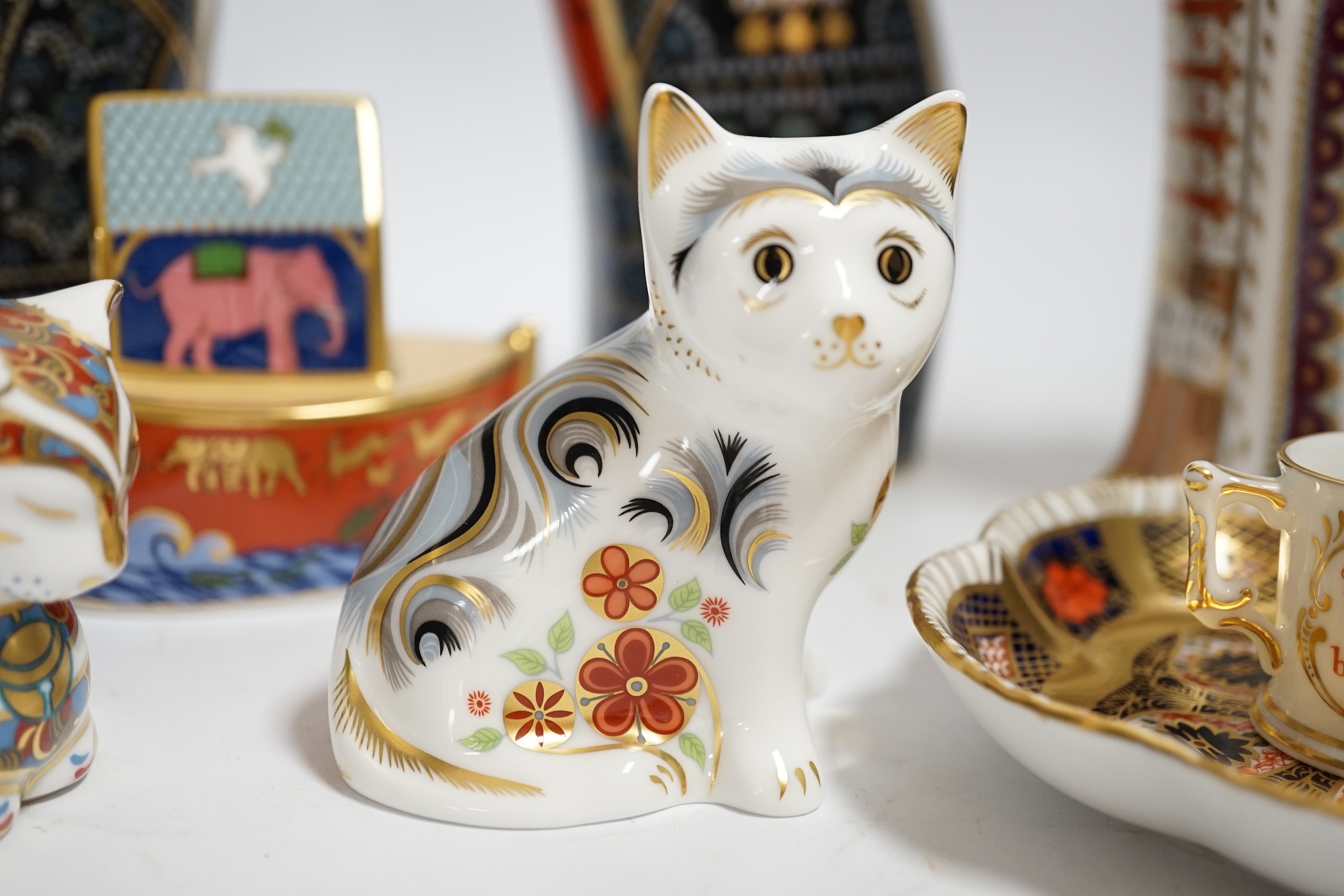 A collection of Royal Crown Derby porcelain and paperweights including Pearly Queen, Pearly King, Russian, etc.